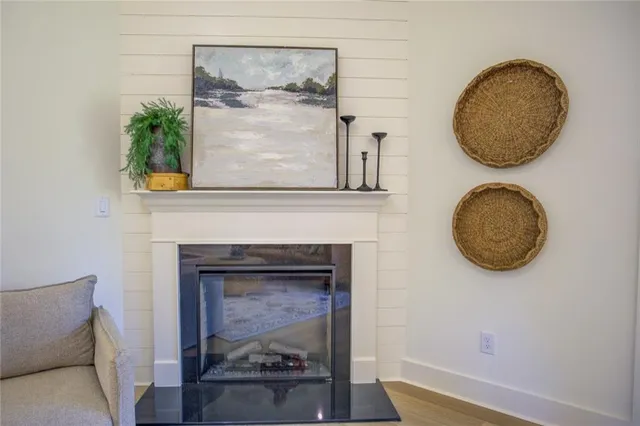 a view of a livingroom with furniture and a mirror