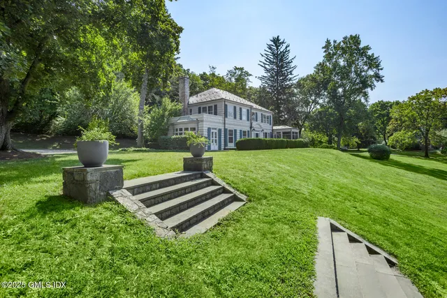 a view of a garden with a bench in a garden