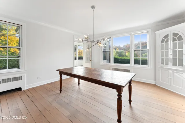 a view of a room with furniture window and wooden floor