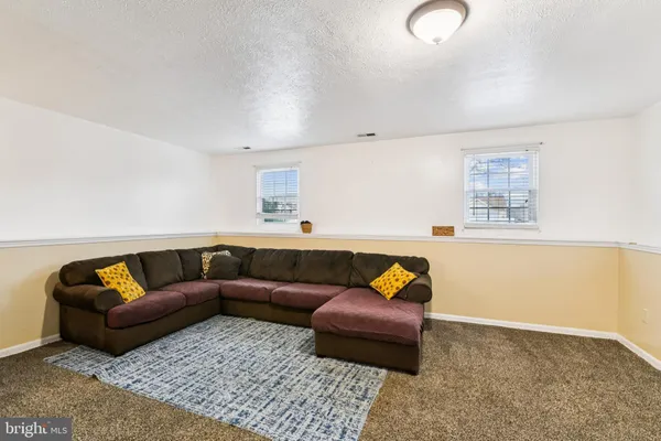 a living room with furniture and a couch
