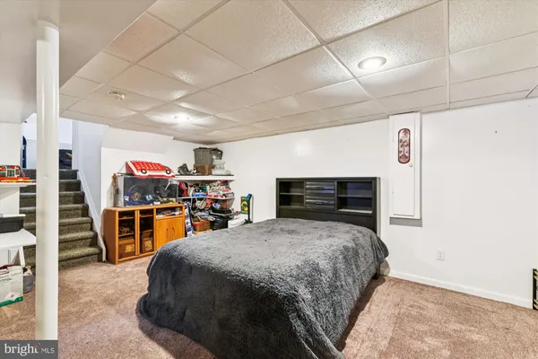 a bedroom with furniture and flat screen tv