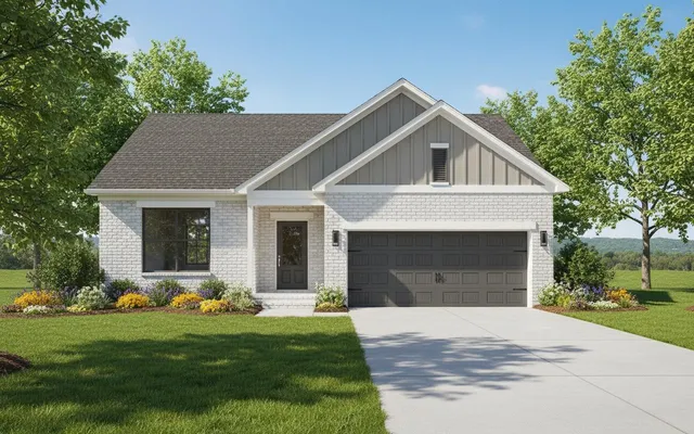 a front view of a house with a garden and plants