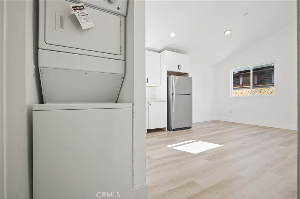9241 1/2 Firth Boulevard, Unit 1/2 Los Angeles, CA 90002 - Photo 12 of 25 a view of a kitchen with a fridge