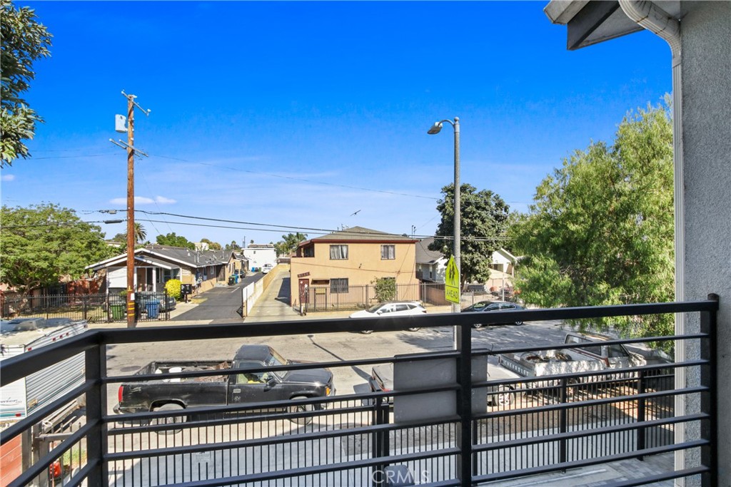 9241 1/2 Firth Boulevard, Unit 1/2 Los Angeles, CA 90002 - Photo 13 of 25 a view of a balcony with two windows