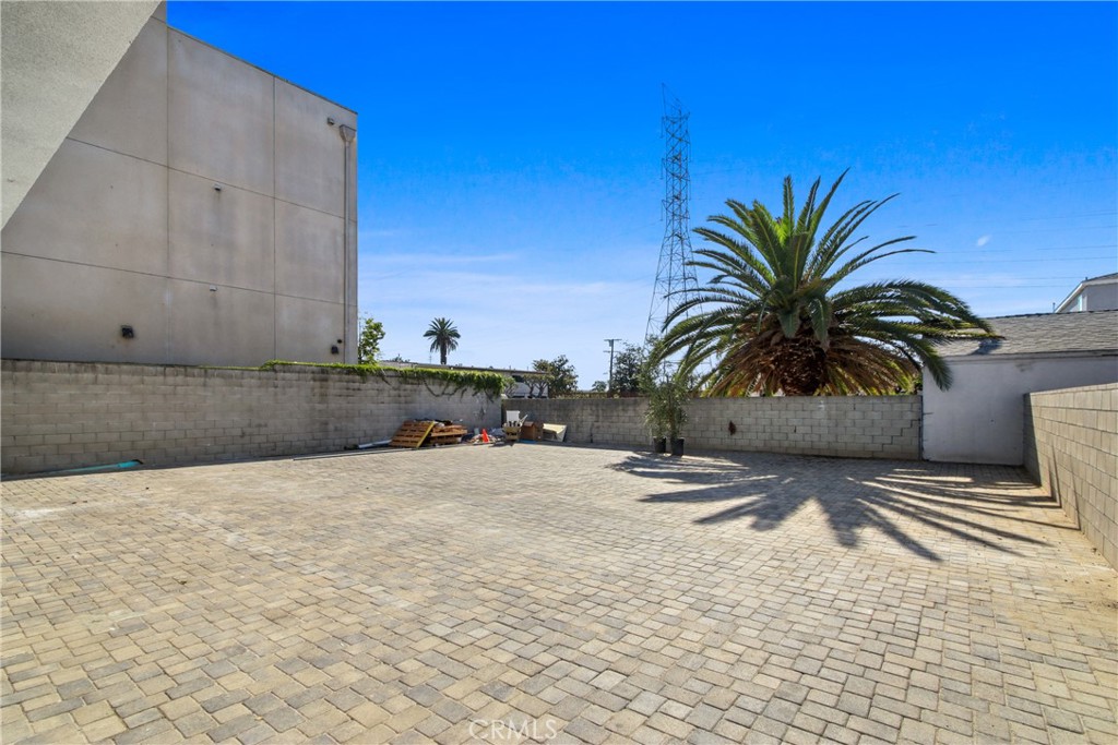 9241 1/2 Firth Boulevard, Unit 1/2 Los Angeles, CA 90002 - Photo 14 of 25 a swimming pool with a bench