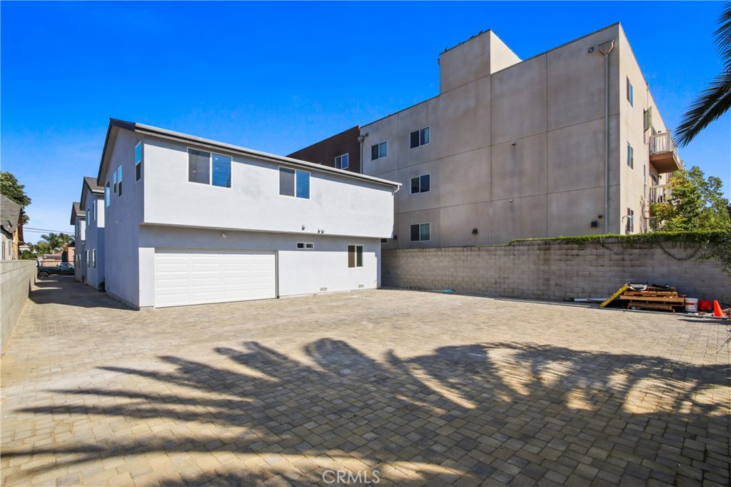 9241 1/2 Firth Boulevard, Unit 1/2 Los Angeles, CA 90002 - Photo 16 of 25 a front view of a house with a snow in front of it