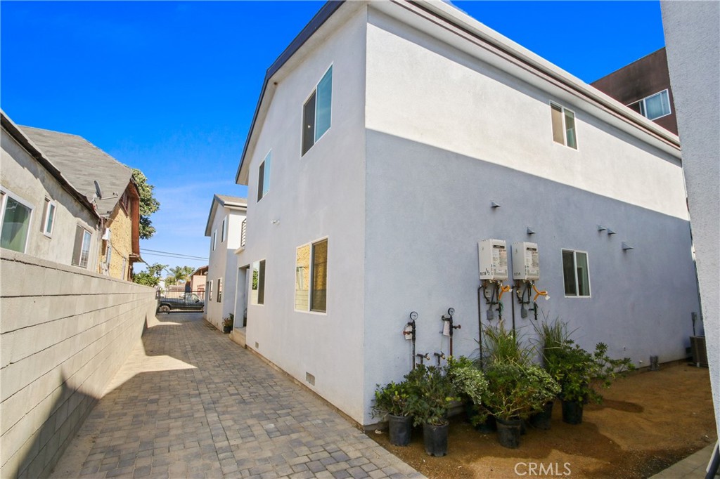 9241 1/2 Firth Boulevard, Unit 1/2 Los Angeles, CA 90002 - Photo 19 of 25 a view of a street with potted plants