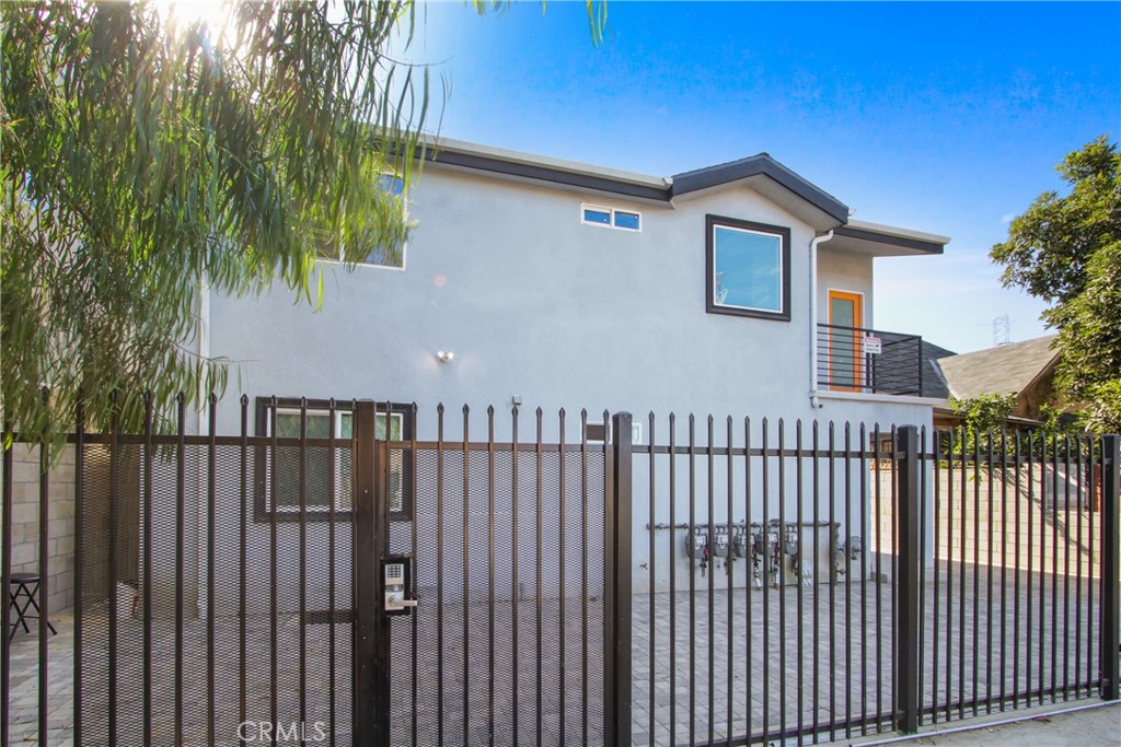 9241 1/2 Firth Boulevard, Unit 1/2 Los Angeles, CA 90002 - Photo 22 of 25 a view of a house with wooden fence