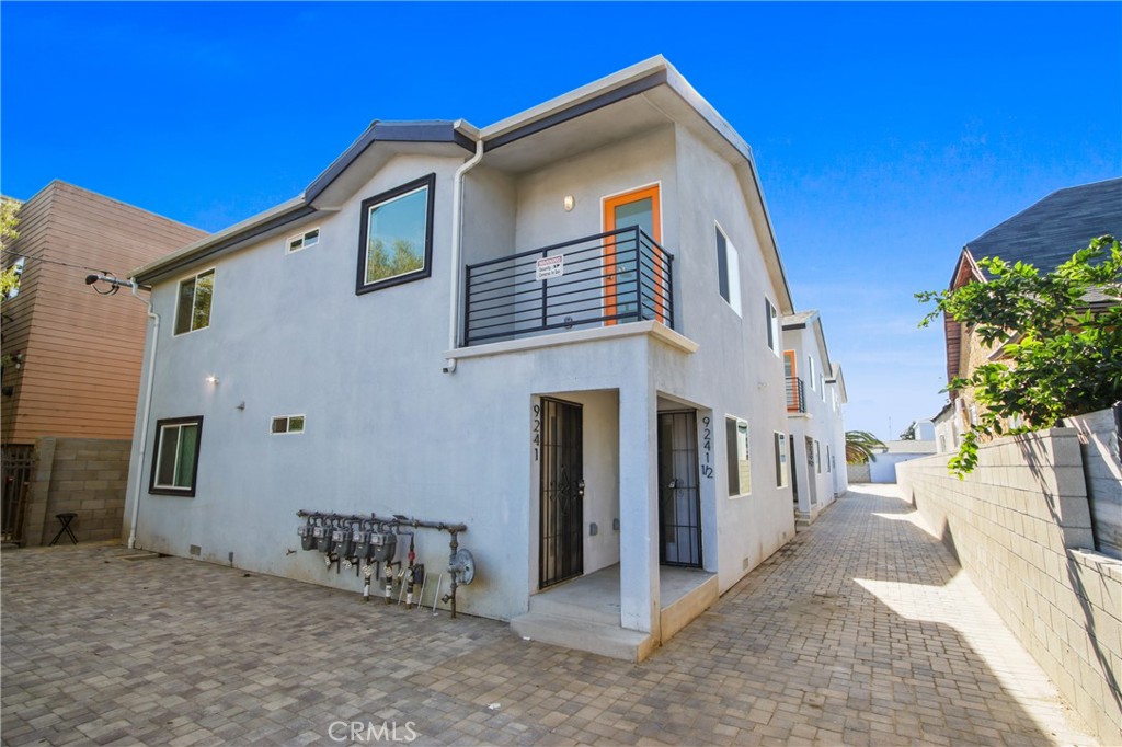 9241 1/2 Firth Boulevard, Unit 1/2 Los Angeles, CA 90002 - Photo 24 of 25 a view of a house with a yard
