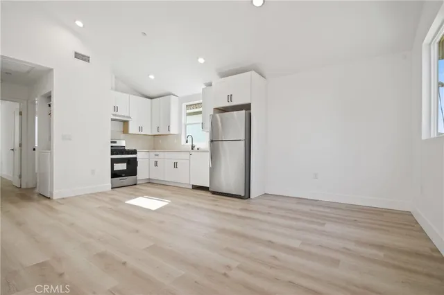 a view of kitchen with wooden floor