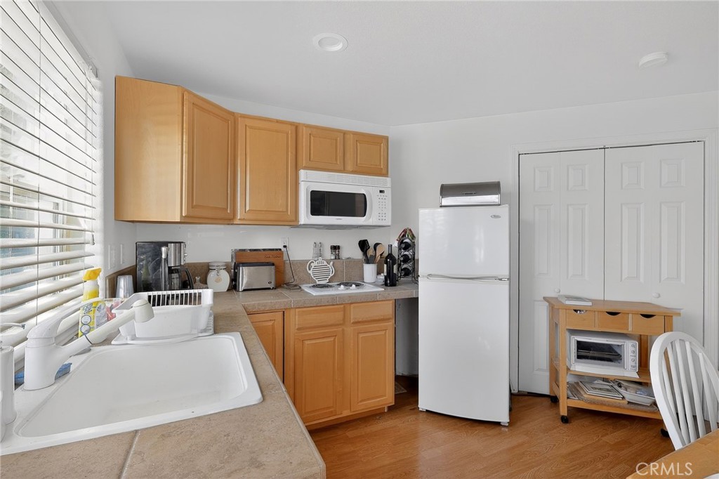 19370 Park Ridge Drive Hidden Valley Lake, CA 95467 - Photo 33 of 61 a kitchen with stainless steel appliances granite countertop a refrigerator sink and stove
