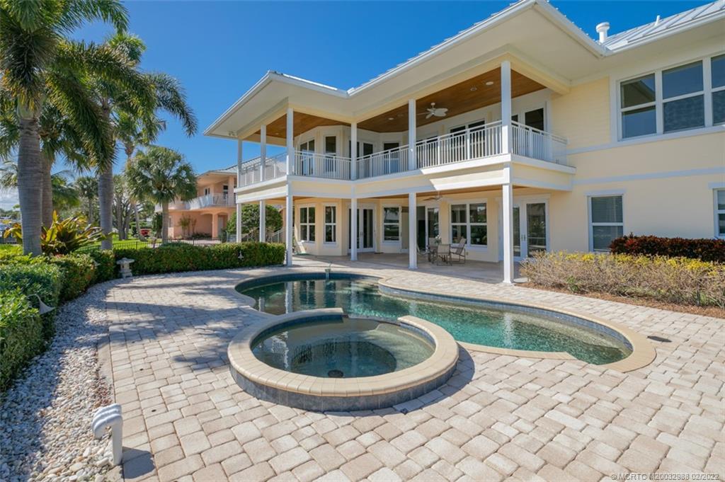 5914 Southeast Horseshoe Point Road Stuart, FL 34997 - Photo 54 of 93 a view of a house with swimming pool and porch