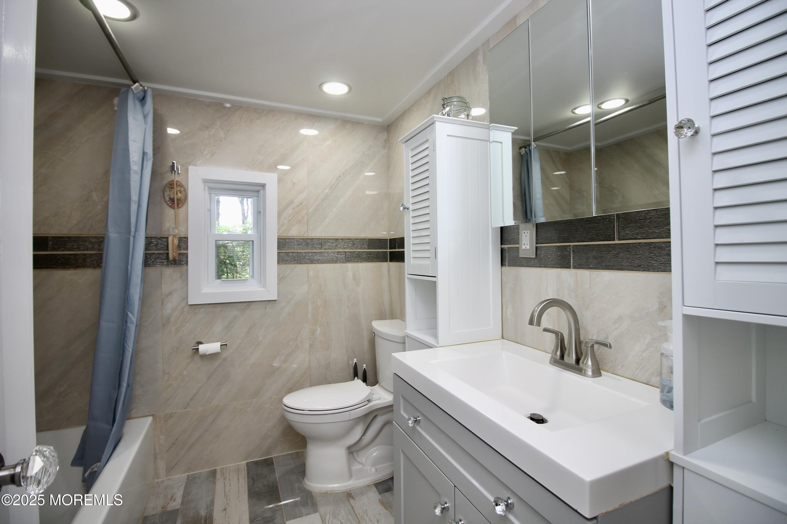 41 Eagle Drive Whiting, NJ 08759 - Photo 20 of 31 a bathroom with a sink toilet and shower