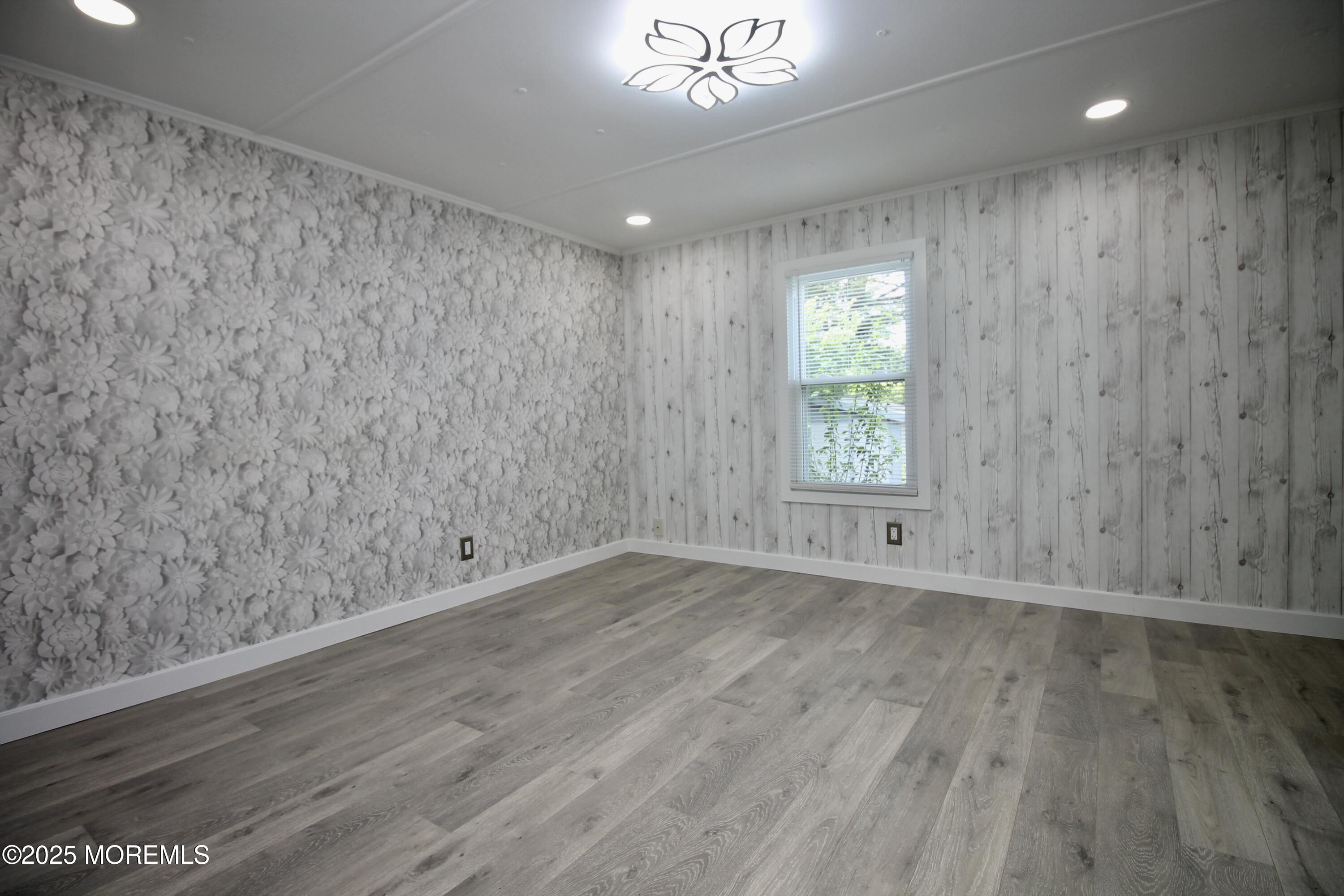 41 Eagle Drive Whiting, NJ 08759 - Photo 22 of 31 wooden floor in an empty room with a window