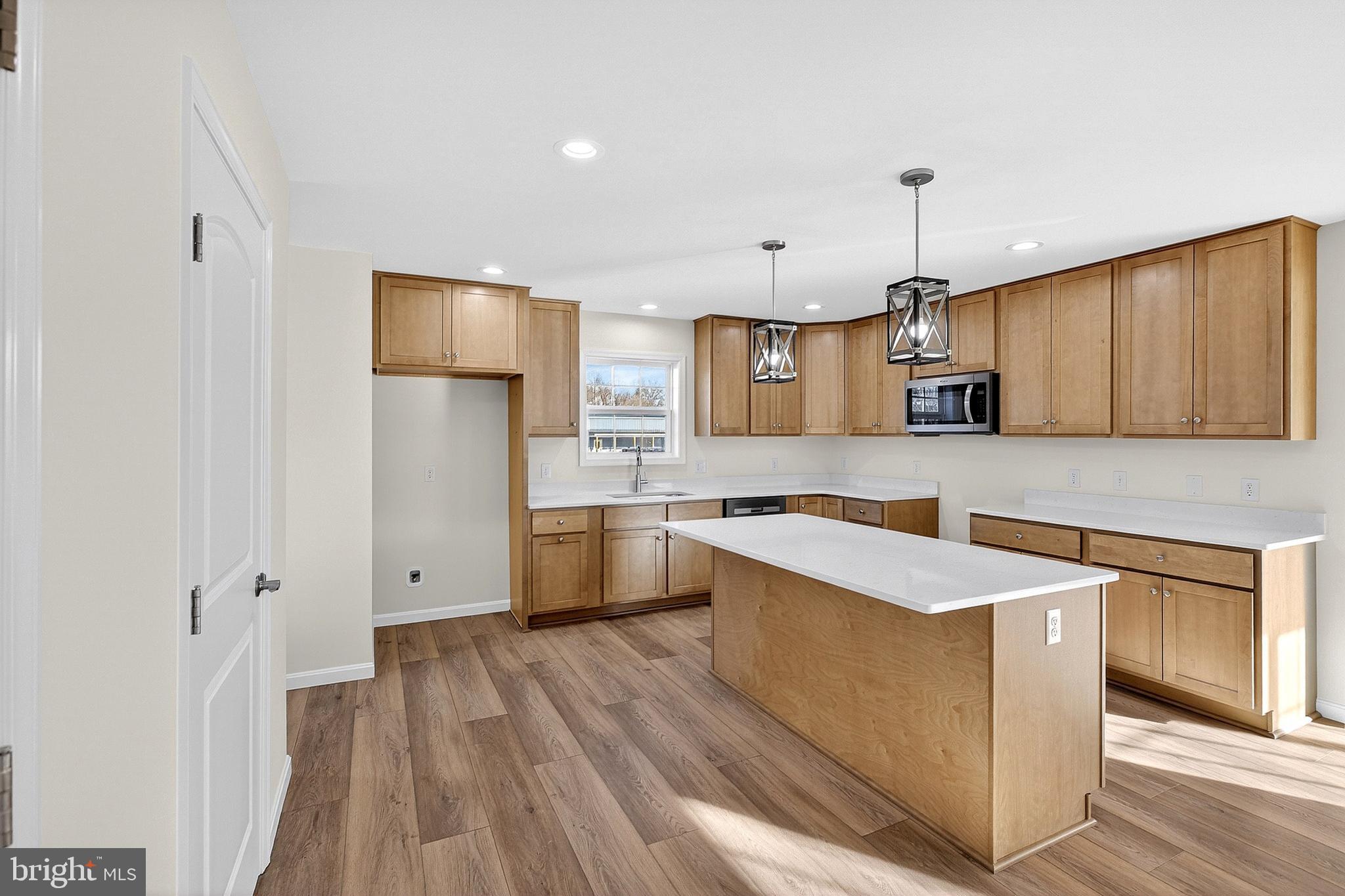 719 West Evens Road Viola, DE 19979 - Photo 12 of 65 a kitchen with a sink a stove a refrigerator and cabinets