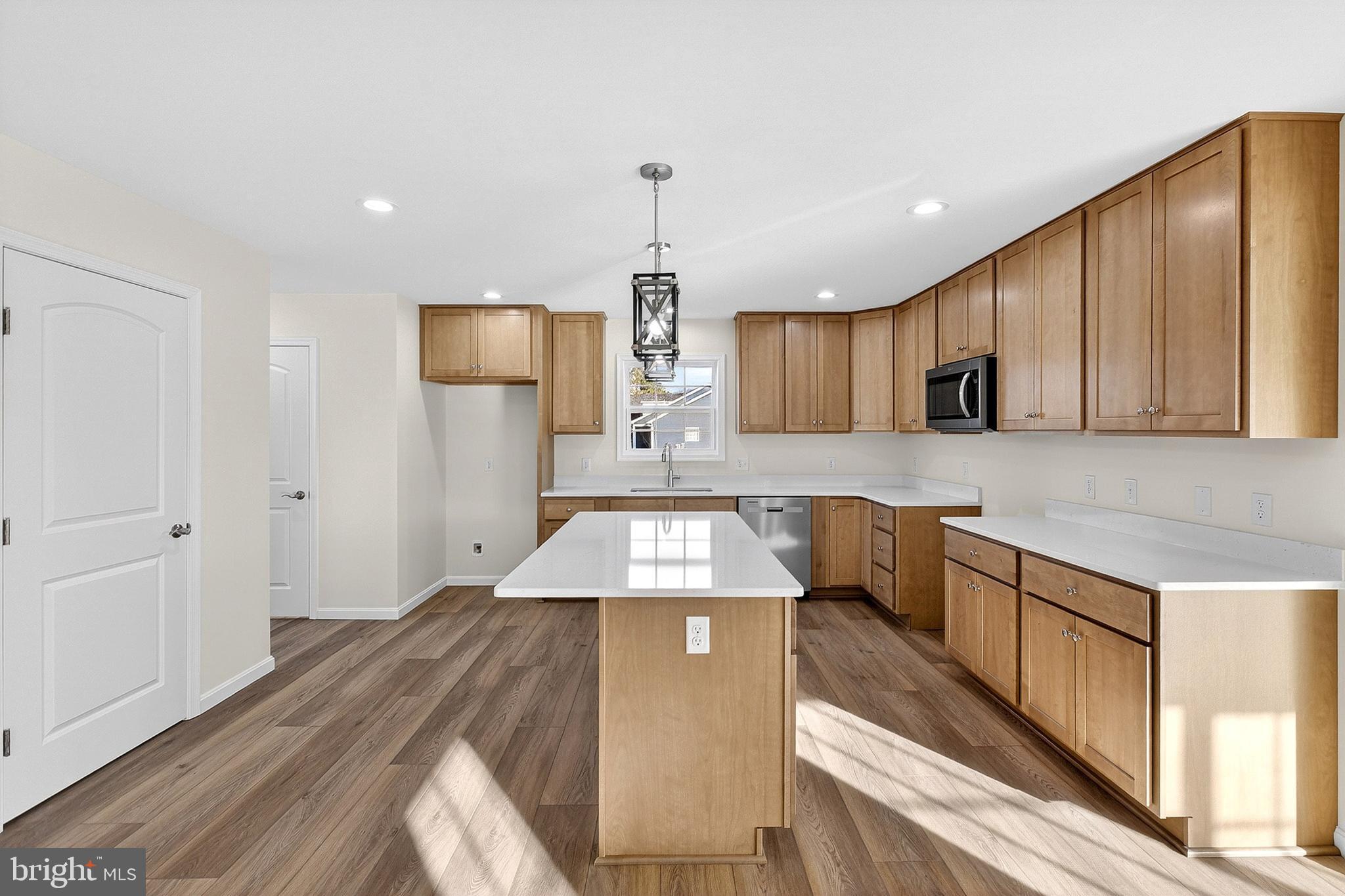 719 West Evens Road Viola, DE 19979 - Photo 13 of 65 a kitchen with stainless steel appliances granite countertop wooden cabinets a stove top oven a sink and dishwasher