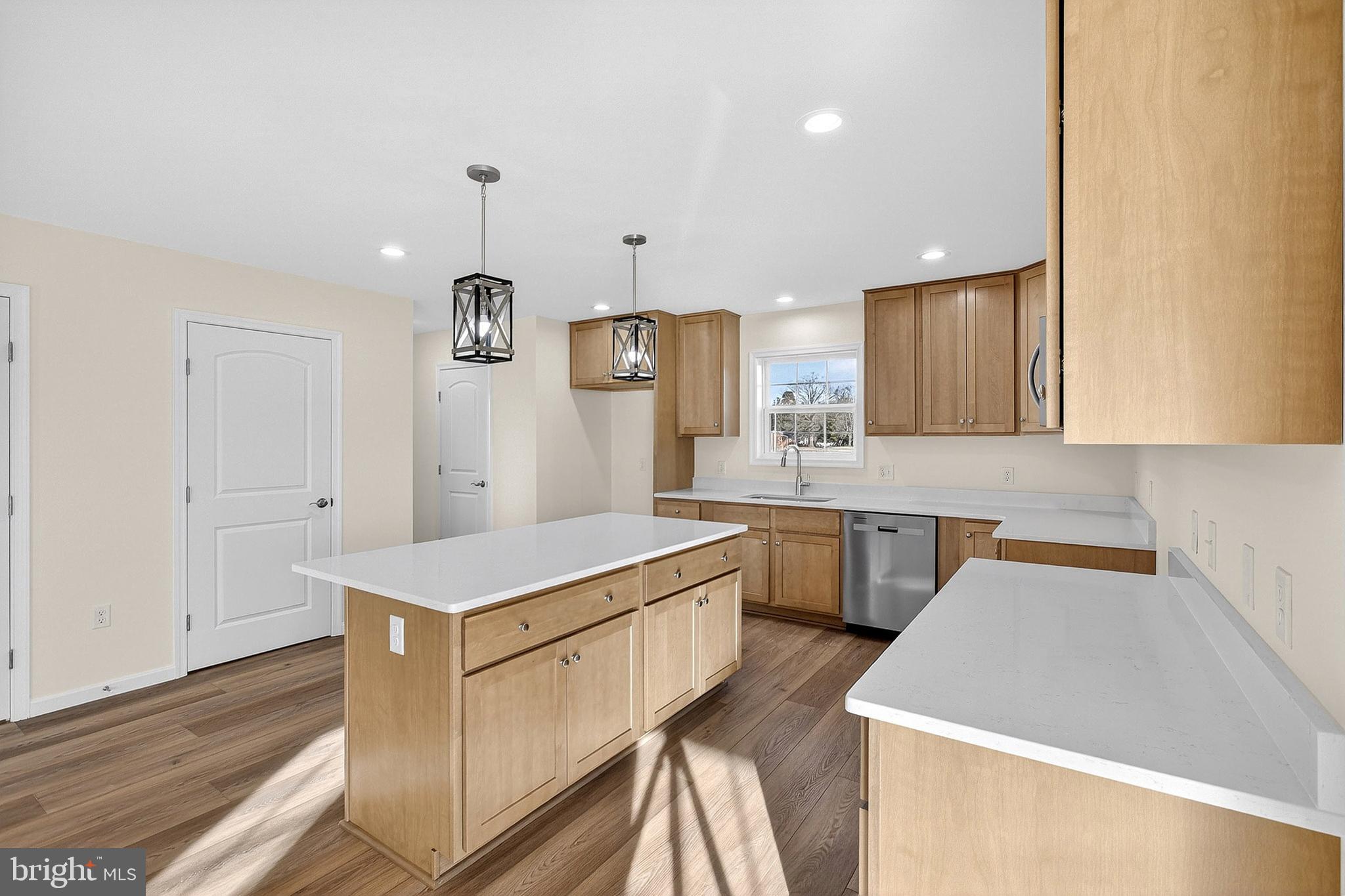 719 West Evens Road Viola, DE 19979 - Photo 14 of 65 a kitchen that has a lot of cabinets in it and wooden floors