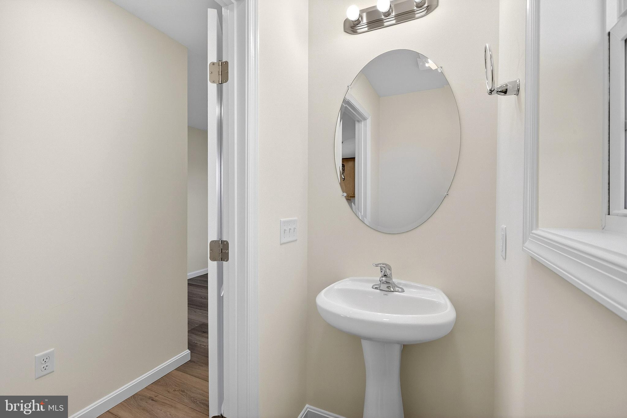 719 West Evens Road Viola, DE 19979 - Photo 18 of 65 a bathroom with a sink and a mirror