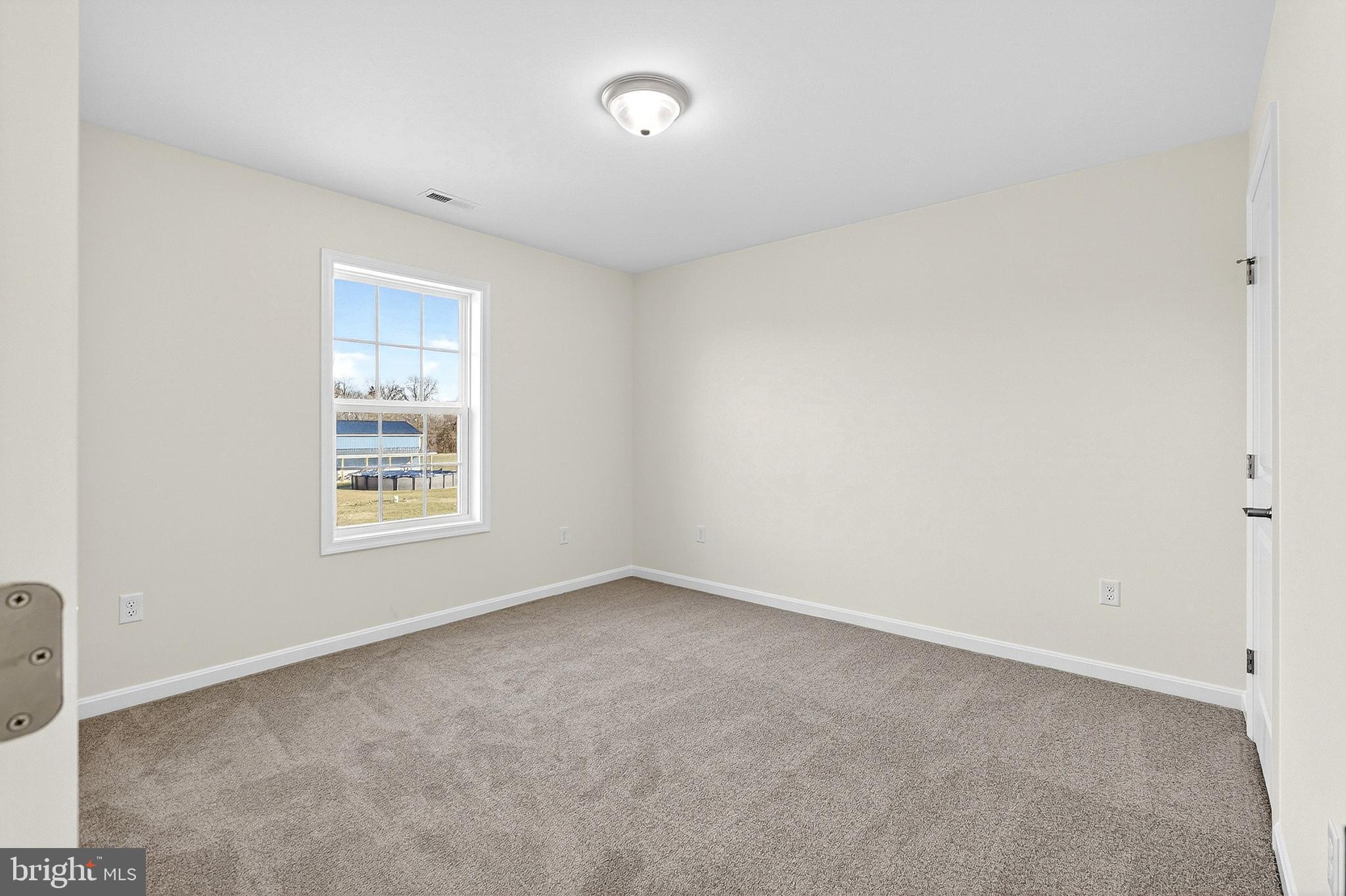 719 West Evens Road Viola, DE 19979 - Photo 29 of 65 an empty room with windows