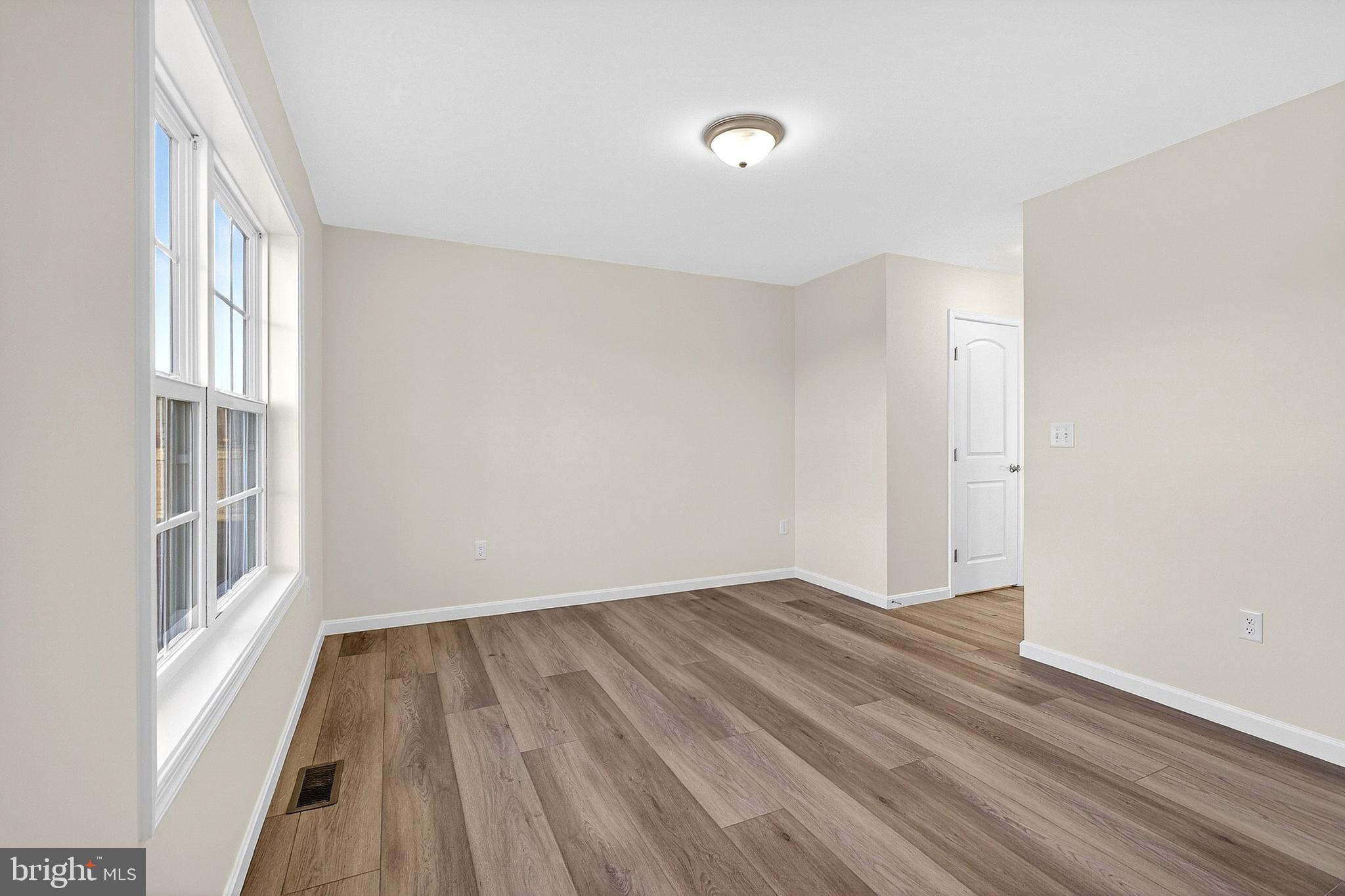 719 West Evens Road Viola, DE 19979 - Photo 5 of 65 wooden floor in an empty room with a window