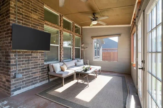 a outdoor space with patio furniture and a fireplace