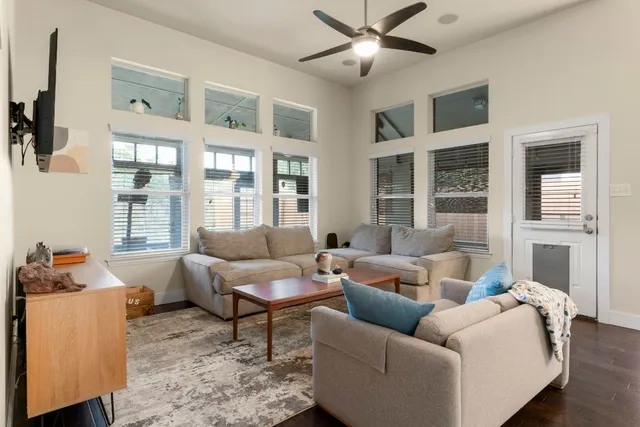 a living room with furniture and a large window