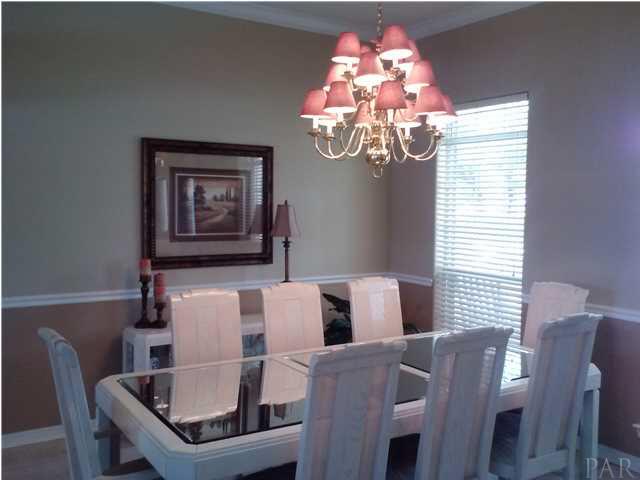 1498 Chemstrand Road Cantonment, FL 32533 - Photo 18 of 23 DISTINCTIVE FORMAL DINING ROOM ACCENTED WITH PLANT LEDGES AND COLUMNS