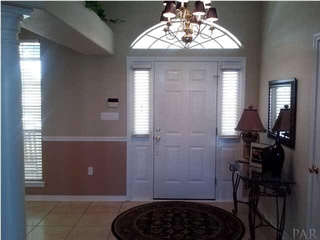 1498 Chemstrand Road Cantonment, FL 32533 - Photo 22 of 23 LARGE FRONT FOYER WITH FORMAL DINING ROOM TO THE LEFT