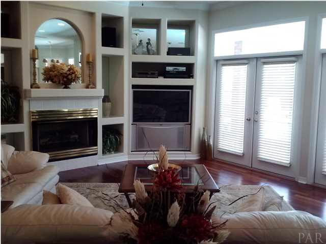 1498 Chemstrand Road Cantonment, FL 32533 - Photo 5 of 23 FAMILY ROOM WITH MULTIPLE SETS OF FRENCH DOORS THAT LEAD TO POOL AREA