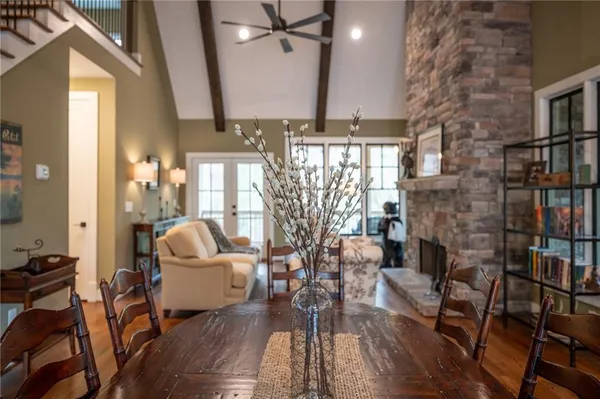 a kitchen with stainless steel appliances granite countertop a sink a stove and a refrigerator