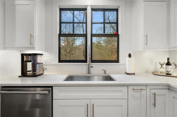 a view of a two chairs in the balcony