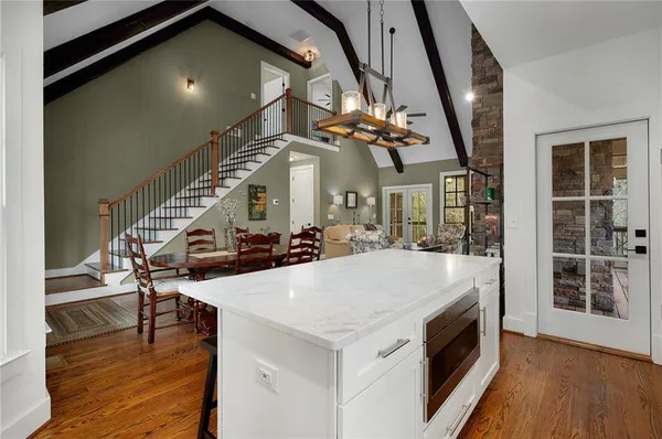 a view of a balcony with wooden fence and floor