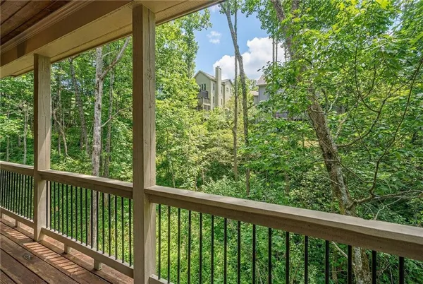 a bathroom with a shower and a sink