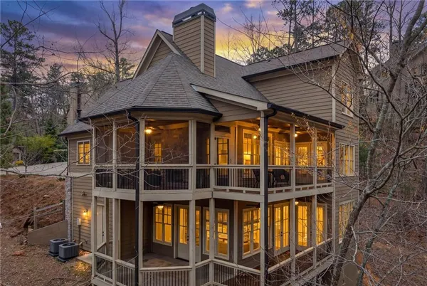 a living room with furniture wooden floor and a fireplace