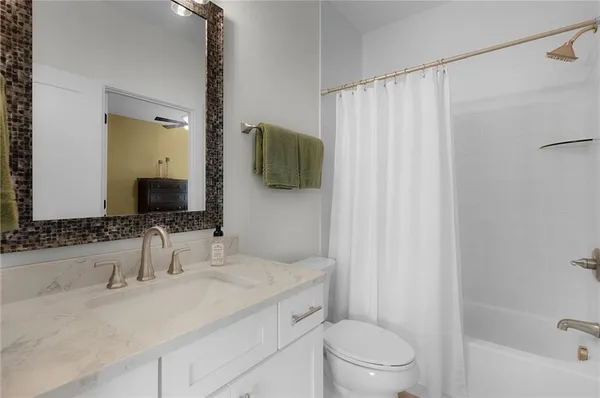 a bathroom with a shower and a toilet
