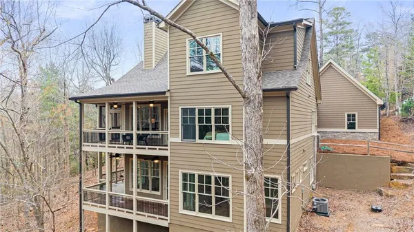 a living room with furniture fireplace and a large window