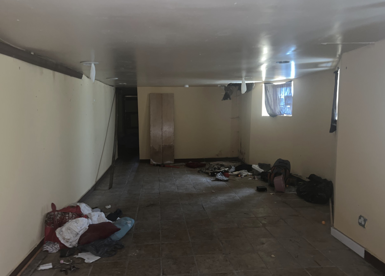 11745 South Wallace Street Chicago, IL 60628 - Photo 11 of 13 a room with water heater and wooden cabinets
