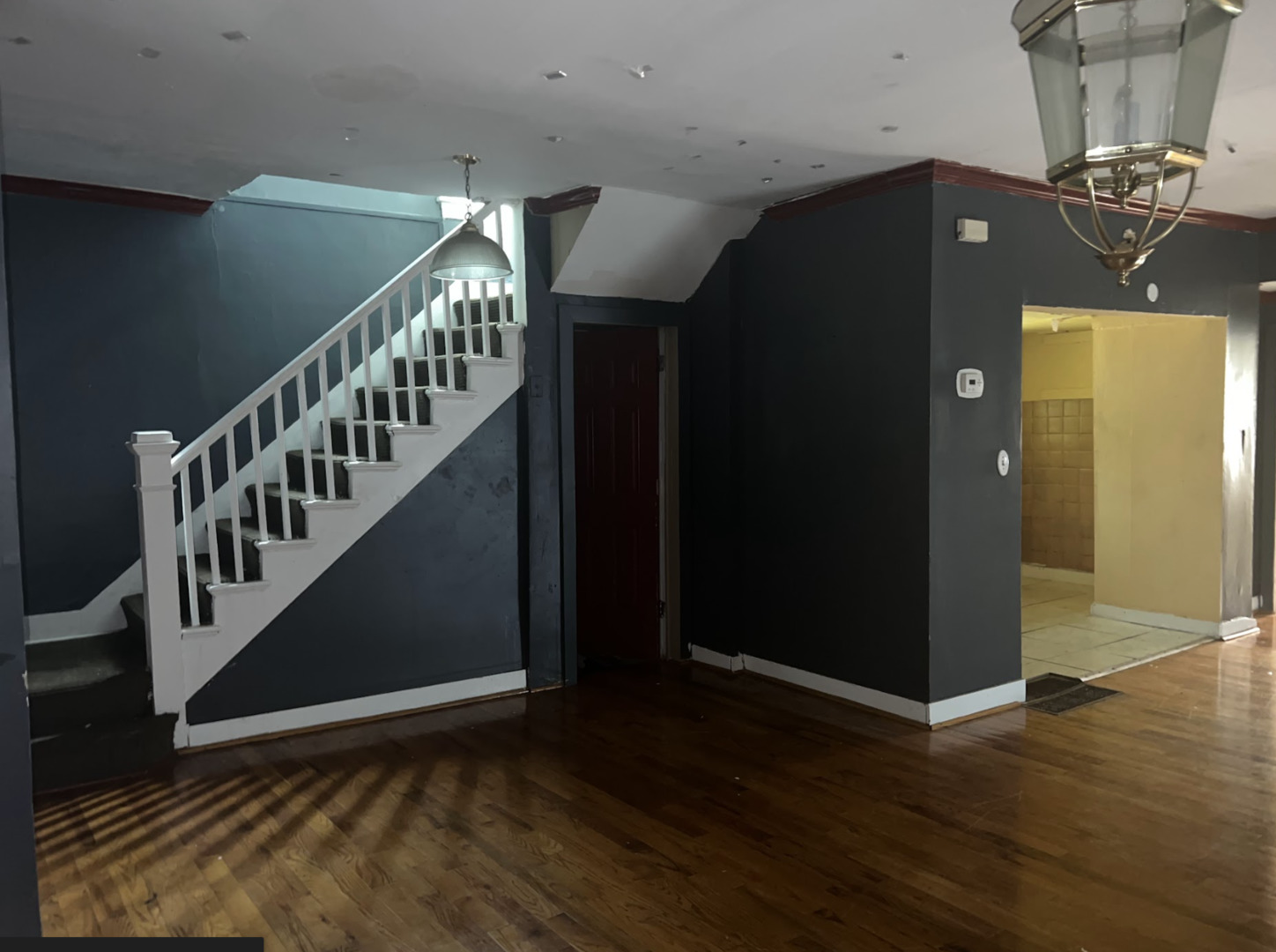 11745 South Wallace Street Chicago, IL 60628 - Photo 3 of 13 a view of entryway and hall with wooden floor