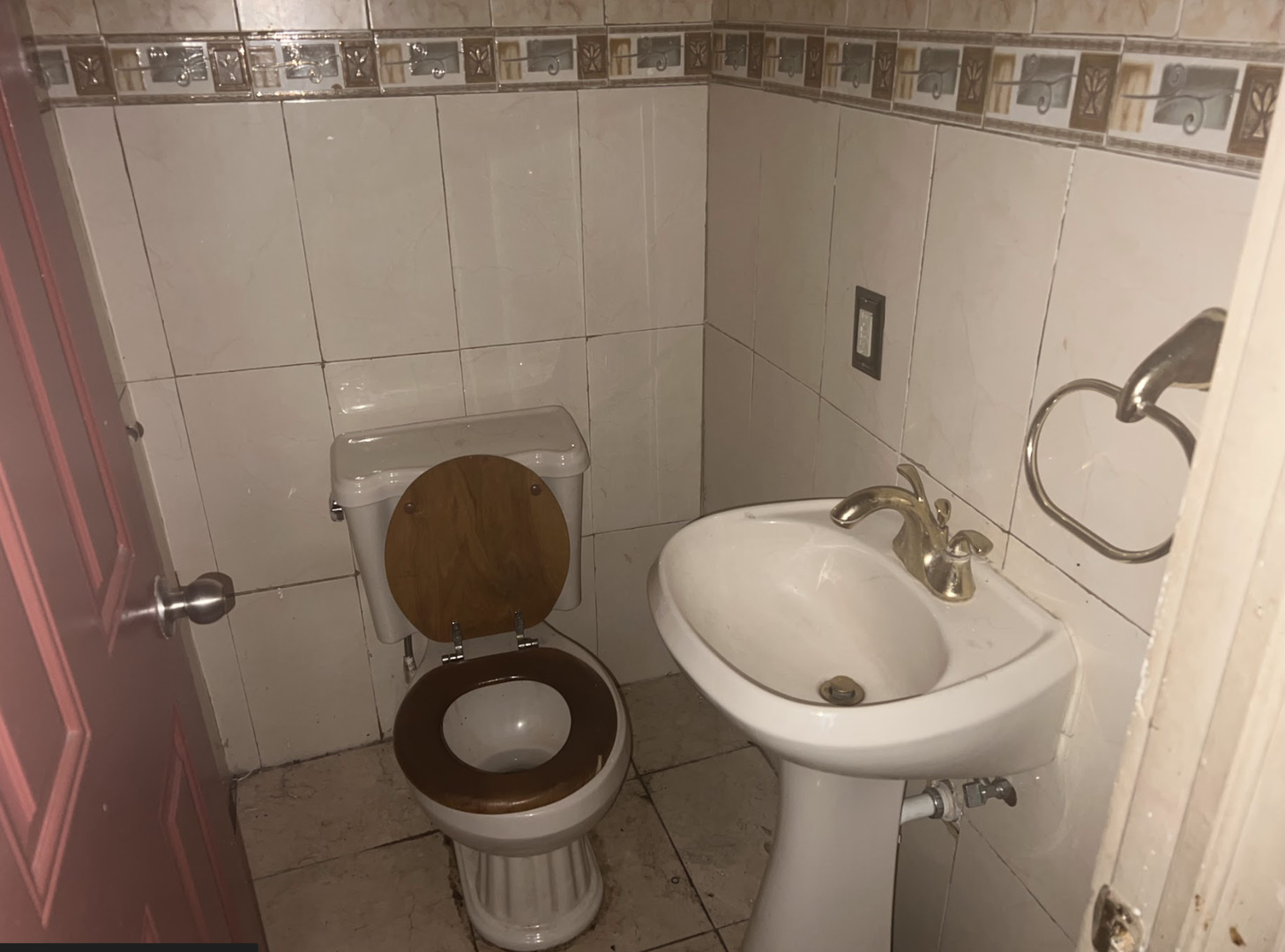 11745 South Wallace Street Chicago, IL 60628 - Photo 6 of 13 a bathroom with a toilet sink and a mirror