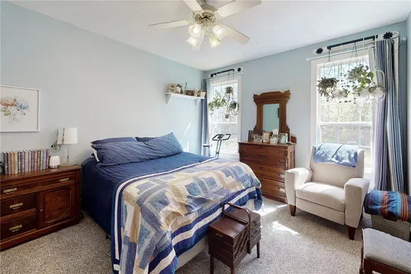 a bedroom with a bed and a couch