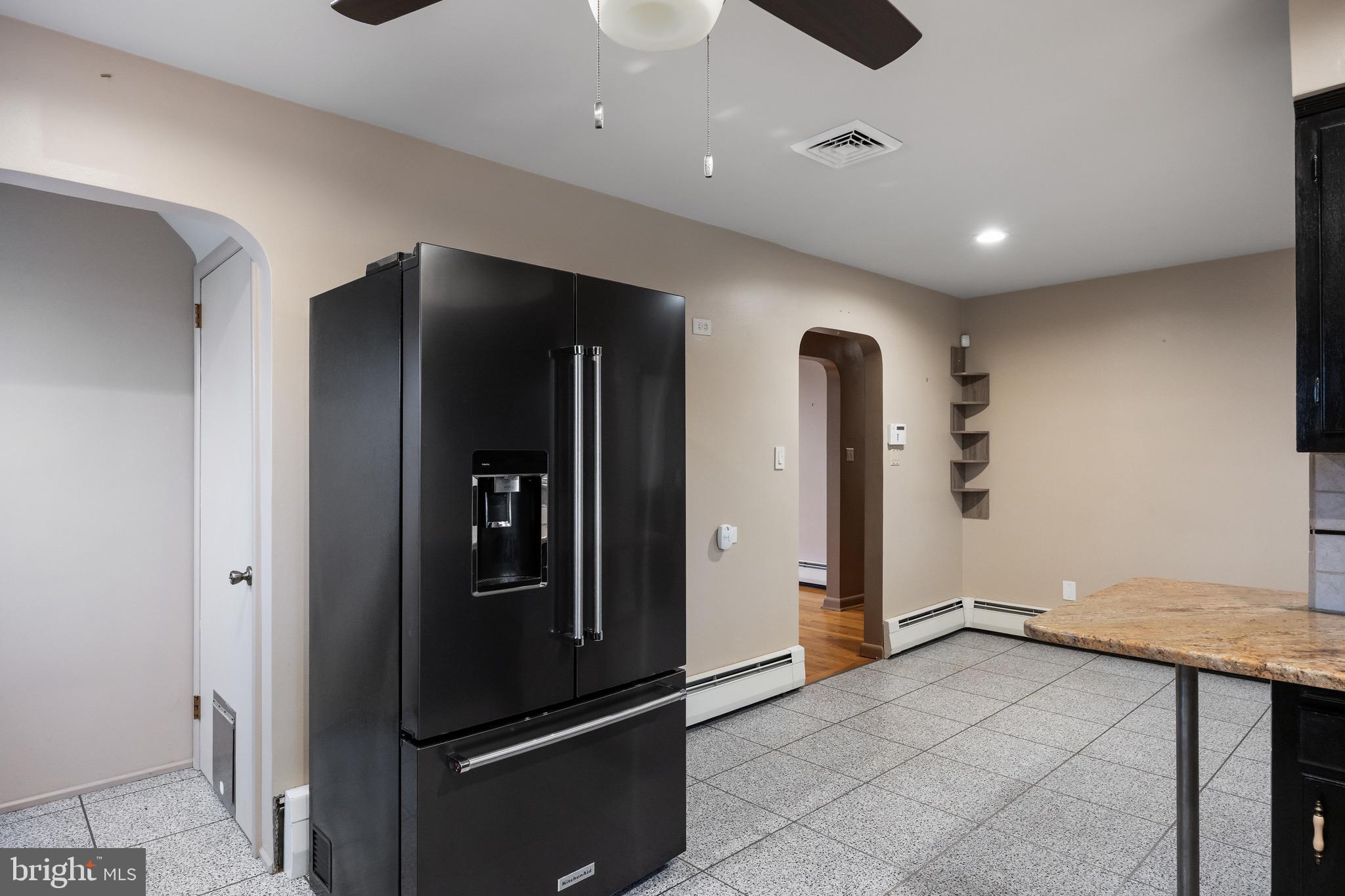 55 East Evesham Road Runnemede, NJ 08078 - Photo 11 of 26 a view of kitchen with refrigerator and wooden floor