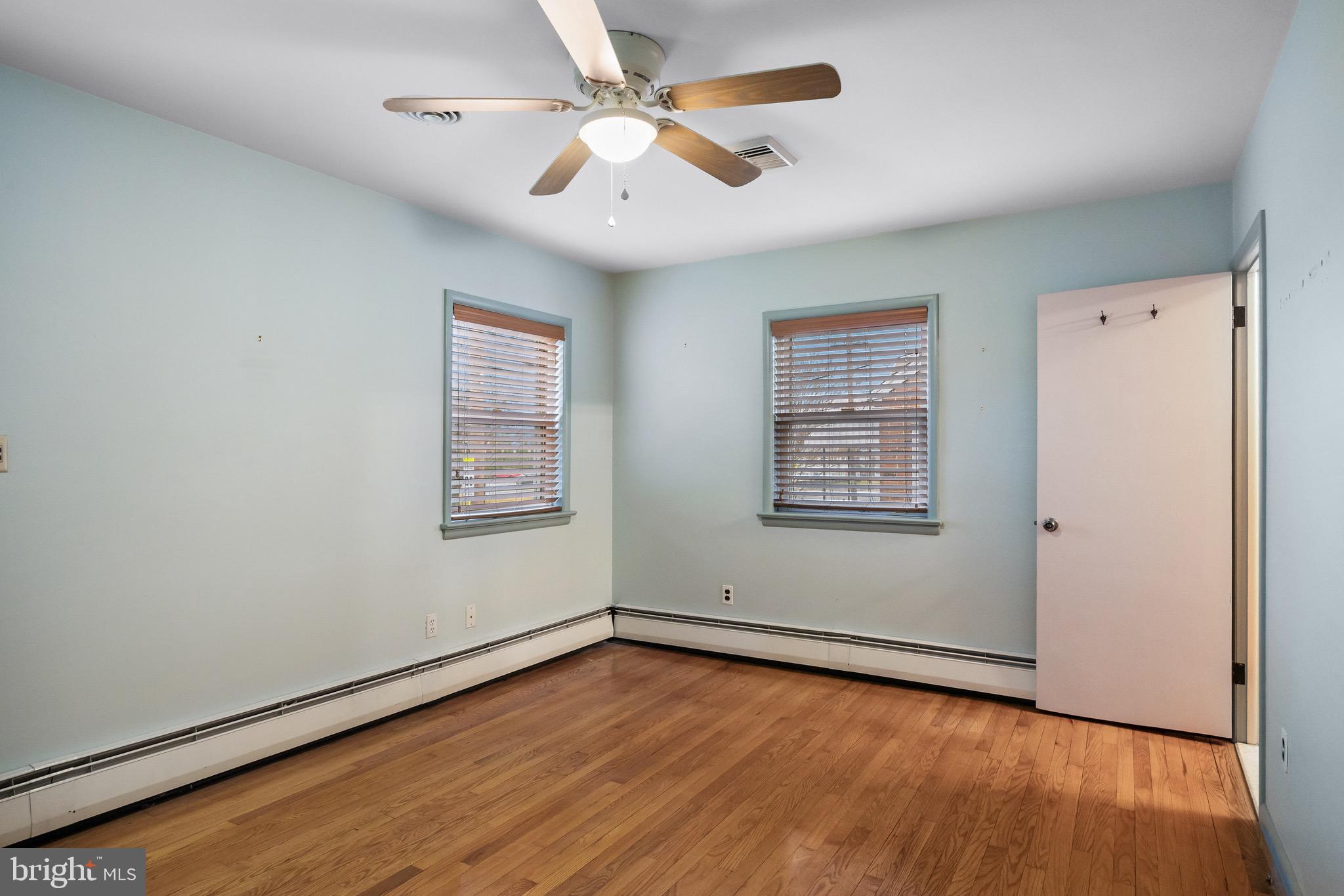55 East Evesham Road Runnemede, NJ 08078 - Photo 12 of 26 wooden floor in an empty room with a window