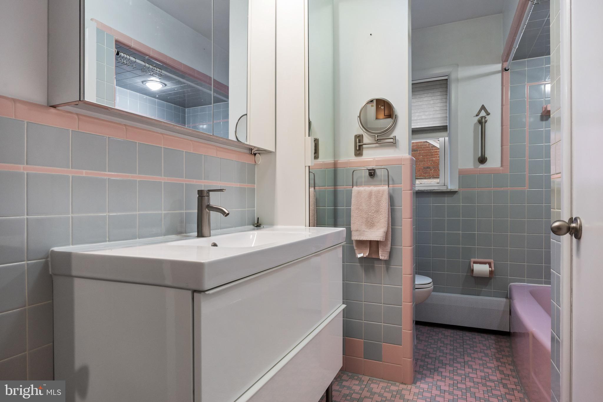 55 East Evesham Road Runnemede, NJ 08078 - Photo 16 of 26 a bathroom with a sink a toilet and shower