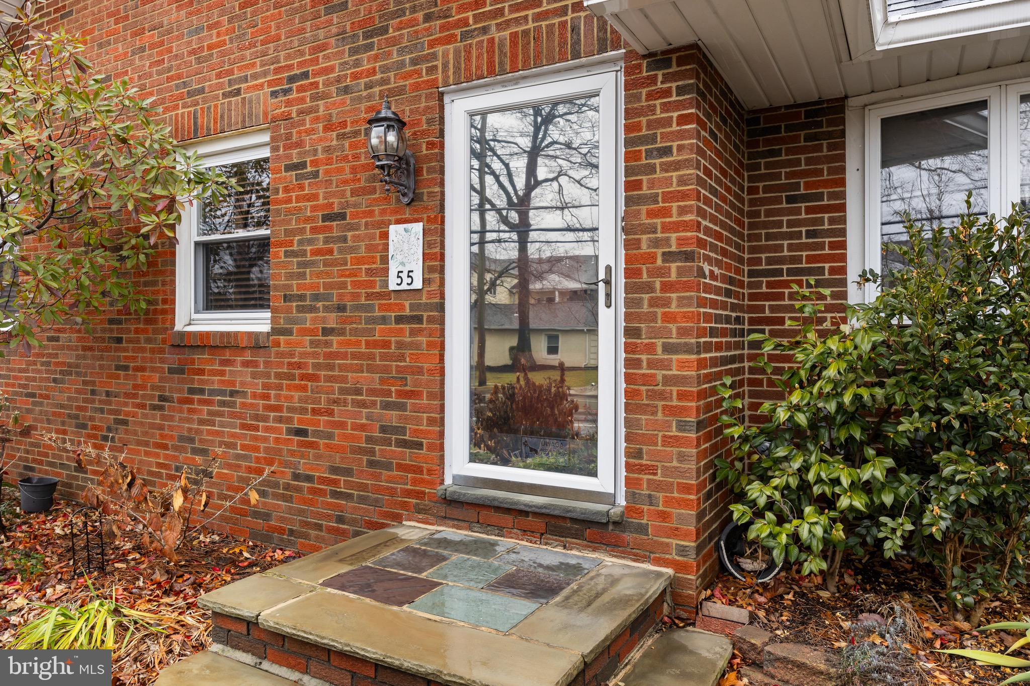 55 East Evesham Road Runnemede, NJ 08078 - Photo 3 of 26 a view of a brick house with a door and a window