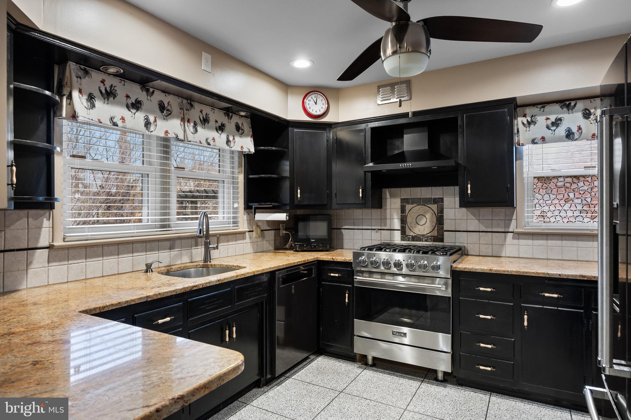55 East Evesham Road Runnemede, NJ 08078 - Photo 8 of 26 a kitchen with stainless steel appliances granite countertop a sink and a stove