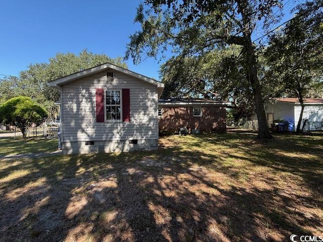 1909 9th Avenue Conway, SC 29527 - Photo 11 of 15 View of side of property with crawl space and a lawn