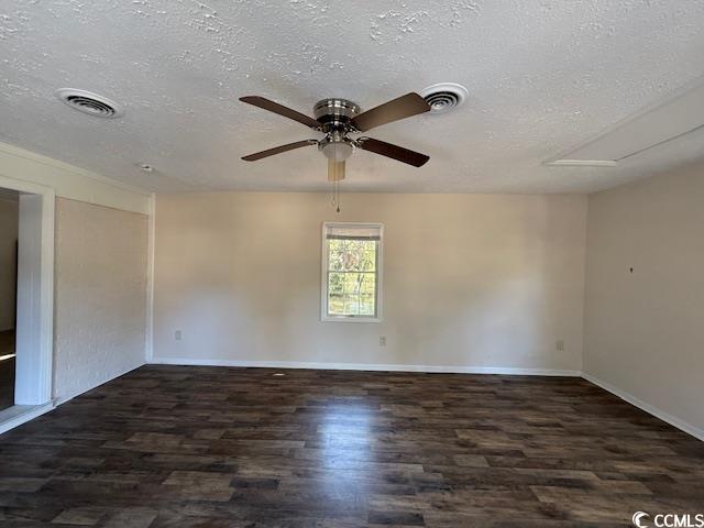 1909 9th Avenue Conway, SC 29527 - Photo 5 of 15 Unfurnished room with a textured ceiling, dark wood finished floors, and a ceiling fan