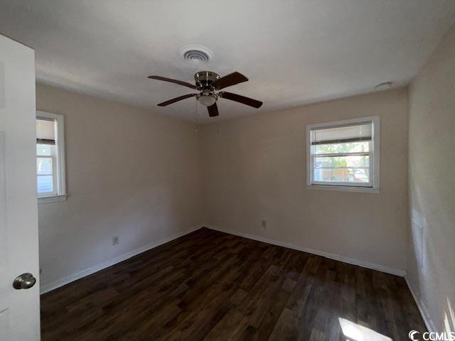 1909 9th Avenue Conway, SC 29527 - Photo 7 of 15 Empty room featuring dark wood finished floors and ceiling fan