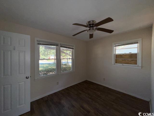 1909 9th Avenue Conway, SC 29527 - Photo 9 of 15 Unfurnished room featuring dark wood-style flooring and a ceiling fan