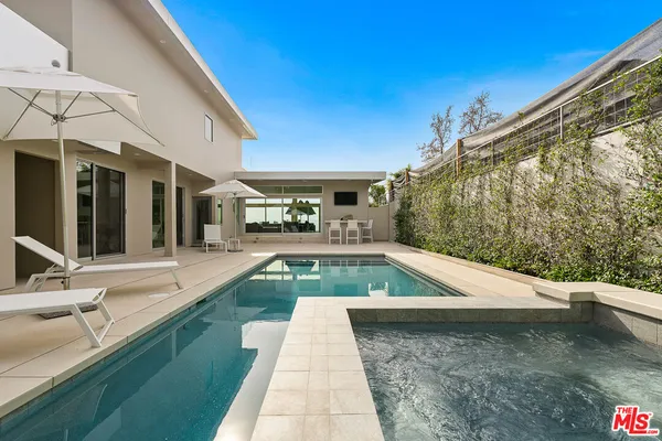 a view of a swimming pool with a patio